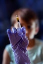 Pediatrician Nurse with an injection in the hand for the vaccination of a child boy Royalty Free Stock Photo