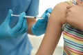 Doctor vaccinating little child in clinic Royalty Free Stock Photo