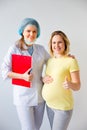 Doctor vaccinating a pregnant woman Royalty Free Stock Photo