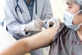 doctor is vaccinating Prevent Covid-19 or Coronavirus for Asian elderly man