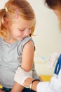 Doctor vaccinating small girl Royalty Free Stock Photo