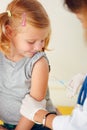 Doctor vaccinating small girl Royalty Free Stock Photo