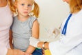 Doctor vaccinating small girl Royalty Free Stock Photo