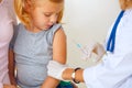 Doctor vaccinating small redhead Royalty Free Stock Photo