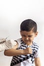 A doctor vaccinating young patient. Little boy scared of injection