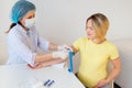 Doctor vaccinating a pregnant woman Royalty Free Stock Photo