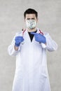 Doctor with a vaccine in his hand, a US dollar mask symbolizing the profit from the sale of vaccinations