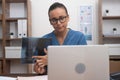 doctor video call, displaying X-ray films to laptop, and elucidating to the patient telemedicine. Royalty Free Stock Photo