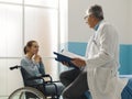 Doctor visiting a paraplegic patient at the hospital Royalty Free Stock Photo