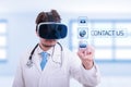 Doctor with vr glasses touching contact us sign Royalty Free Stock Photo