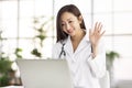 Doctor watching laptop computer and having video conference at clinic Royalty Free Stock Photo