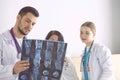 Doctor watching x-ray photography of elder woman