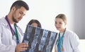 Doctor watching x-ray photography of elder woman