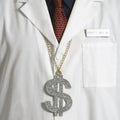 Doctor wearing dollar sign.