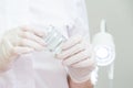 Doctor wearing medical gloves holding a pack of rectal or vaginal suppositories Royalty Free Stock Photo
