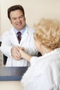 Doctor Welcomes Patient Royalty Free Stock Photo