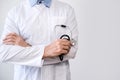 doctor in white coat with crossed arms and stethoscope Royalty Free Stock Photo