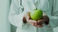 The doctor holding apple.AI generated image Royalty Free Stock Photo