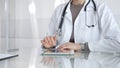 Doctor using digital tablet for remote medical consultation, providing modern healthcare services, telehealth concept Royalty Free Stock Photo