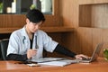 Doctor in white uniform working in medical clinic.