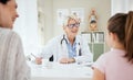 A doctor who truly cares. a mature female doctor talking to a patient at a hospital. Royalty Free Stock Photo