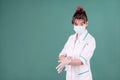 Doctor woman in gloves on green background Royalty Free Stock Photo