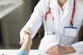 Doctor woman greet patient and shake hand, medical worker in uniform