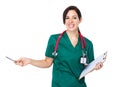 Doctor woman hold with clipboard and pen point up Royalty Free Stock Photo