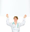 Doctor woman holding blank billboard over her head Royalty Free Stock Photo