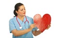 Doctor woman holding heart shape Royalty Free Stock Photo