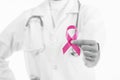 Doctor woman holding pink ribbon, of breast cancer awareness Royalty Free Stock Photo