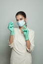 Doctor woman holding syringe and ampoule ready for injecting on white background. Medicine, cosmetology and vaccination concept