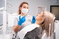 doctor woman holding syringe with dental anesthesia. Medicine, dentist and healthcare concept. Dentist hand in a glove