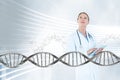 Doctor woman looking up with 3D DNA strand Royalty Free Stock Photo