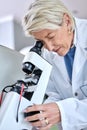 Doctor woman, ophthalmology and microscope for glasses tools to check and zoom on lens. Medical person at work for