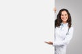 Doctor woman presenting behind blank white board Royalty Free Stock Photo