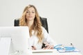 Doctor Woman Sitting On Her Desk Royalty Free Stock Photo