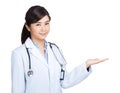 Doctor woman with stethoscope and hand showing something