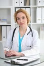 Doctor woman at work. Physician typing on laptop computer. Medicine, healthcare concept