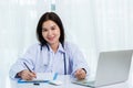 Doctor woman writing something on paperwork or clipboard white paper Royalty Free Stock Photo