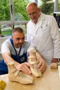 Doctor and worker preparing orthopedic insoles for a patient