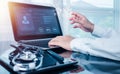 doctor working on a laptop computer for health records in the medical office.The concept is checking and taking care of Royalty Free Stock Photo