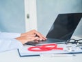 Doctor working with laptop computer in her office. Health care a Royalty Free Stock Photo