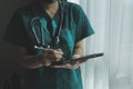 Doctor working with laptop computer in medical workspace office. doctor working on laptop computer in modern clinics office. Royalty Free Stock Photo