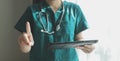 Doctor working with laptop computer in medical workspace office. doctor working on laptop computer in modern clinics office. Royalty Free Stock Photo