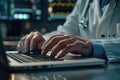 Doctor working with laptop computer and writing on paperwork. Hospital background Royalty Free Stock Photo