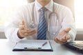 Doctor working with medical statistics and financial reports in office Royalty Free Stock Photo