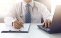 Doctor working with medical statistics and financial reports in office Royalty Free Stock Photo