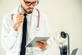 Doctor working on tablet computer in the hospital. Royalty Free Stock Photo