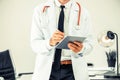 Doctor working on tablet computer in the hospital Royalty Free Stock Photo